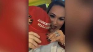 latina woman removing maga hat