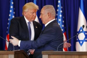 President Donald Trump shakes hands with Israeli Prime Minister Benjamin Netanyahu.
