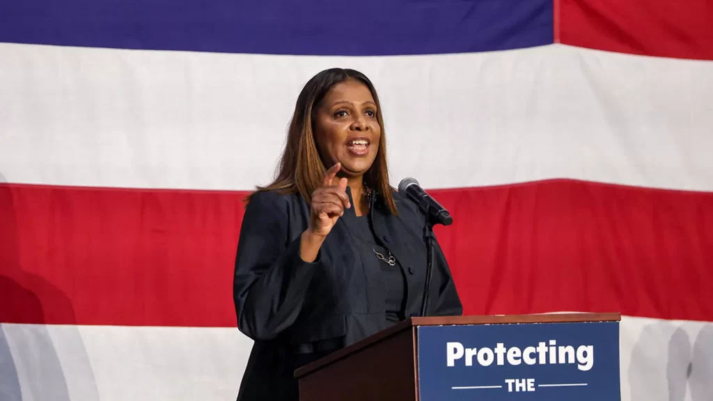 A woman speaking passionately at a podium with a banner reading "Protecting the" against a red, white, and blue background.