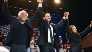 Bernie Sanders, AOC, and Zohran Mamdani raise hands at Queens rally as crowd chants “Tax the rich.