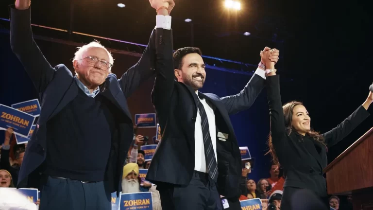 Bernie Sanders, AOC, and Zohran Mamdani raise hands at Queens rally as crowd chants “Tax the rich.