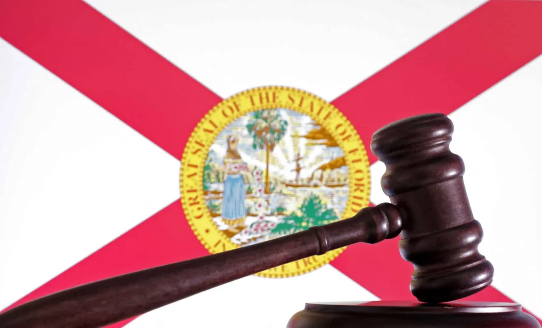 U.S. Court of Appeals UPHOLDS Floridaโs Law Protecting Kids from Predatory, Addictive Social Media A wooden gavel rests on a block in front of the Florida state flag