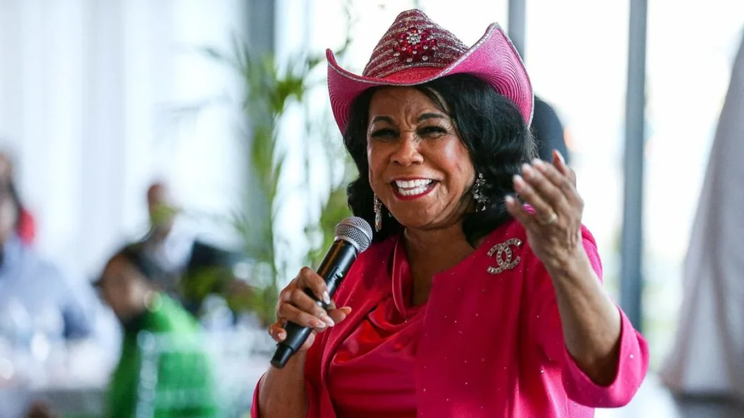 Frederica Wilson’s Retirement Highlights the Failure of Identity Politics, Not Florida’s Redistricting Person in a bright pink outfit and matching hat speaking into a microphone, gesturing with their hand in a blurred indoor setting.