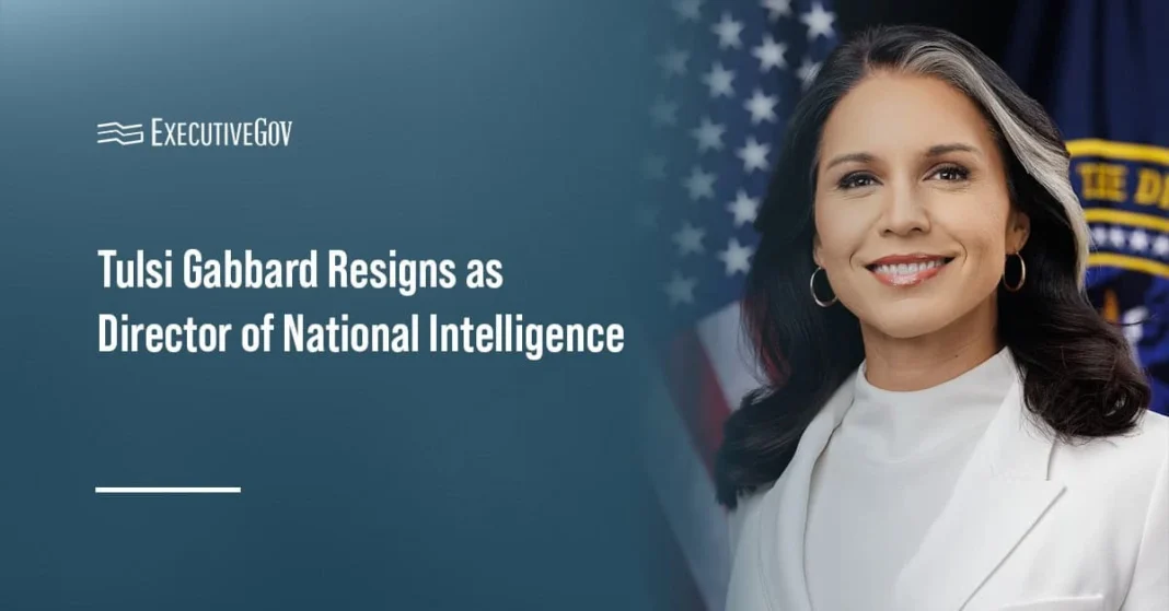 Tulsi Gabbard Resigns as Director of National Intelligence, Cites Husband’s Cancer Battle Text on left: "Tulsi Gabbard Resigns as Director of National Intelligence" with American flag and official seal blurred behind a woman in a white suit on the right.