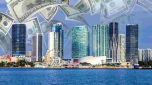 City skyline with high-rise buildings and large floating US dollar bills above a waterfront.