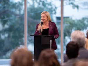 Palm Beach County Mayor Sara Baxter speaking during a public event after ending her congressional campaign.
