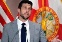 Florida AG Charges Canadian Citizen Accused of Voting in Seven Elections Florida Attorney General James Uthmeier speaks at a podium with American and Florida flags behind him.
