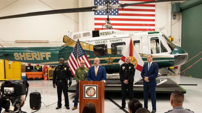 florida-immigration-enforcement-funding-2026 Florida CFO Blaise Ingoglia joins Collier County law enforcement officials during an immigration-enforcement funding announcement.