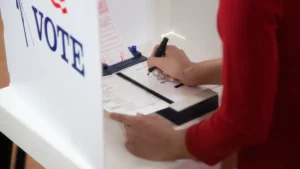A Florida voter marks a ballot inside a voting booth during the 2026 election.